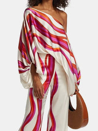 Elegant satin women's asymmetrical set with trousers