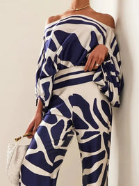 Elegant satin women's asymmetrical set with trousers